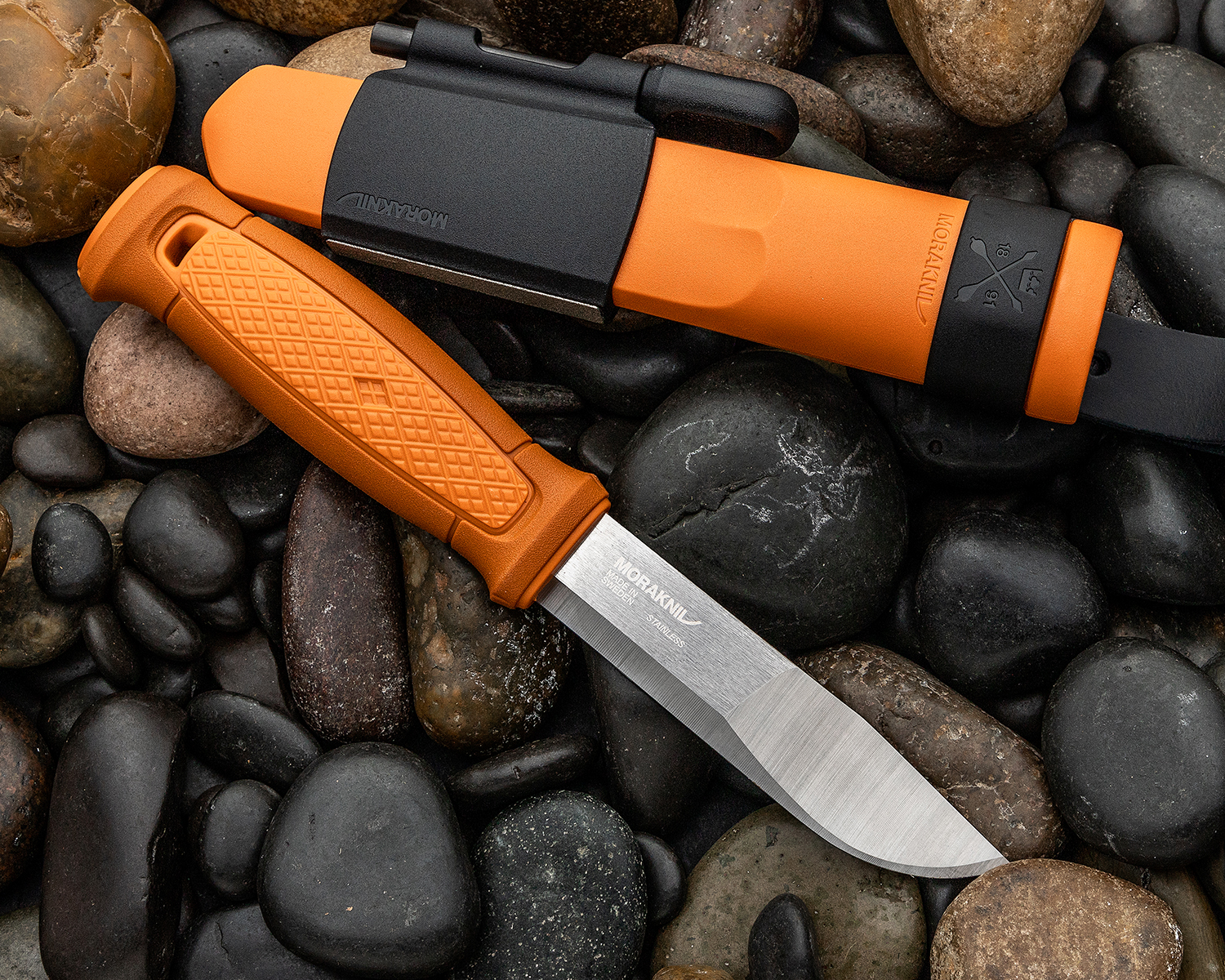 Mora Kansbol fixed blade knife on river rocks
