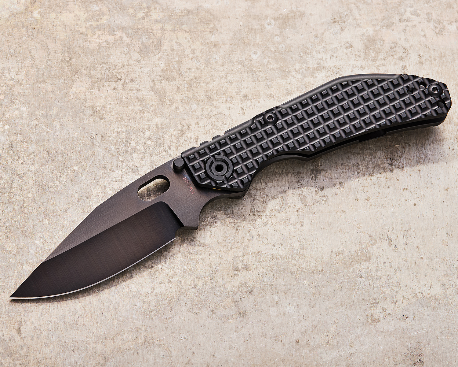 north Mountain Blade BBNM folding knife on marbled background