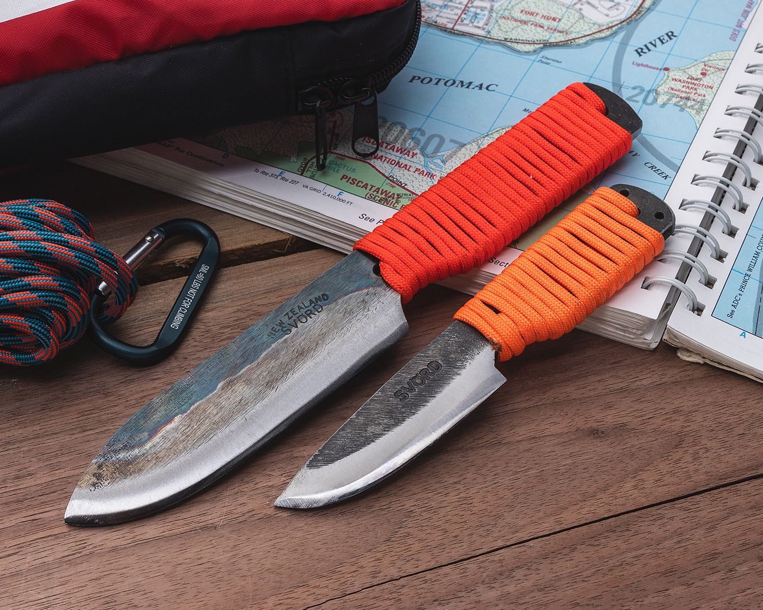 2 Svord fixed blades with orange paracord wrapped handles