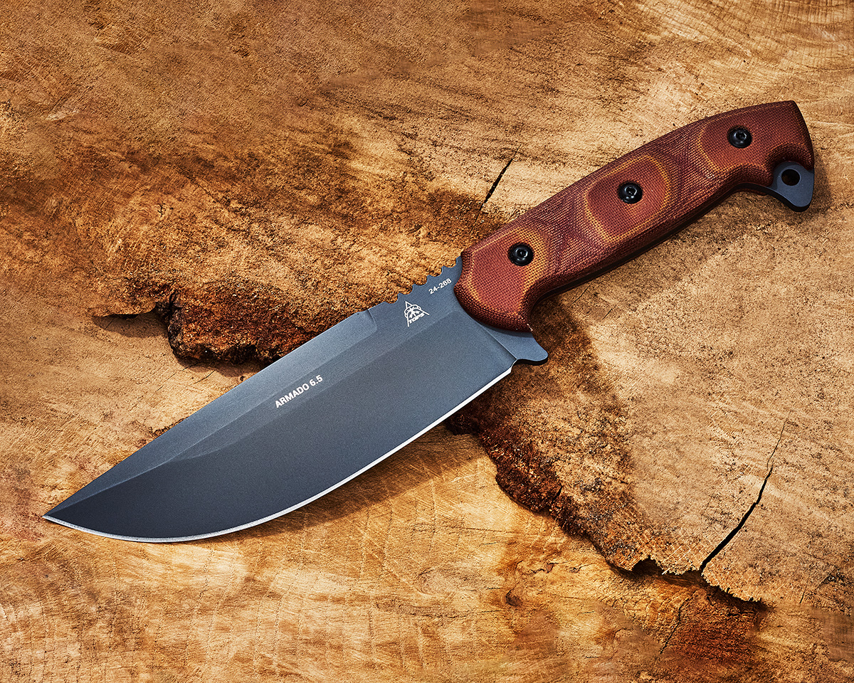 TOPS Armado 6.5 fixed blade knife displayed laying on wood