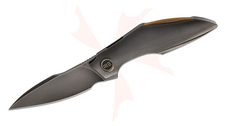 We Knife Company Tashi Bharucha Krait Snake Liner Lock Flipper Knife 3.34 inch M390 Polished Gray Harpoon Blade and Contoured Titanium Handles, Golden Accents