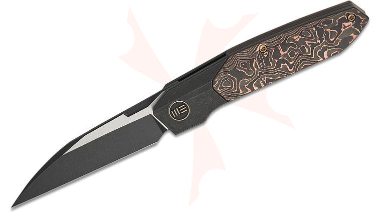We Knife Company Rafal Brzeski Brr15 Bolster Lock Flipper Knife 3.25 inch M390 Two-Tone Wharncliffe Blade, Black Bolstered Titanium Handles with Copper Foil Carbon Fiber Scales